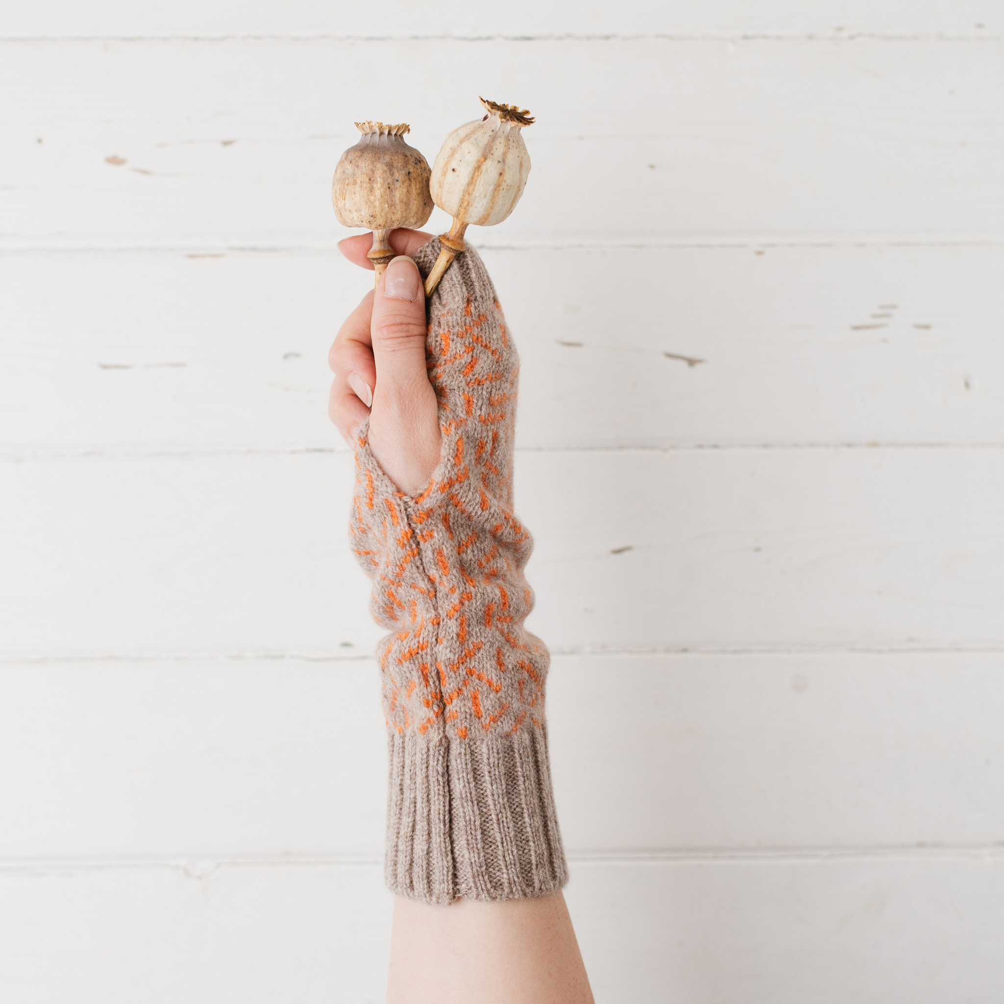 Scatter wrist warmers - cobble and orange soda