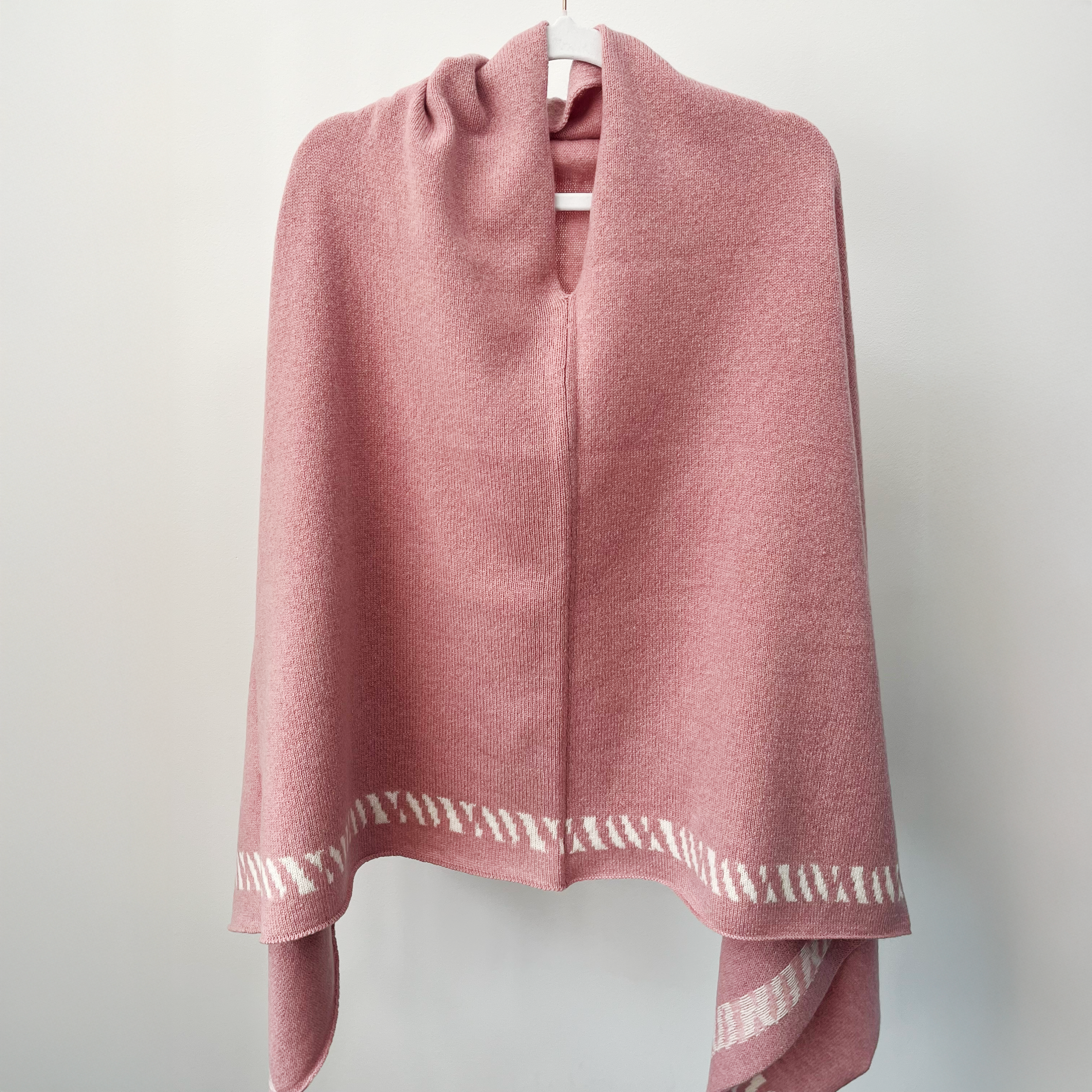 Lambswool knitted poncho - calamine pink and white