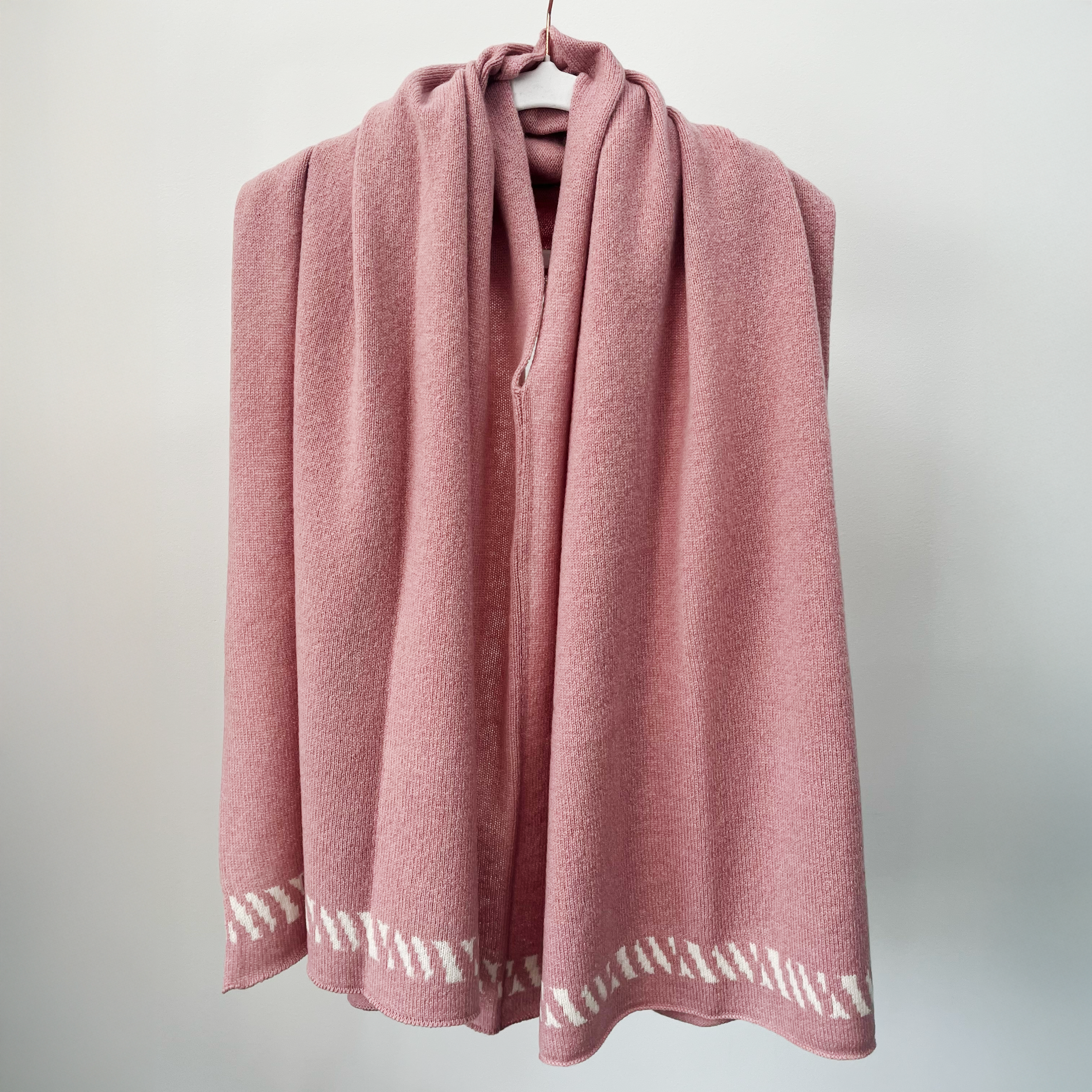 Lambswool knitted poncho - calamine pink and white