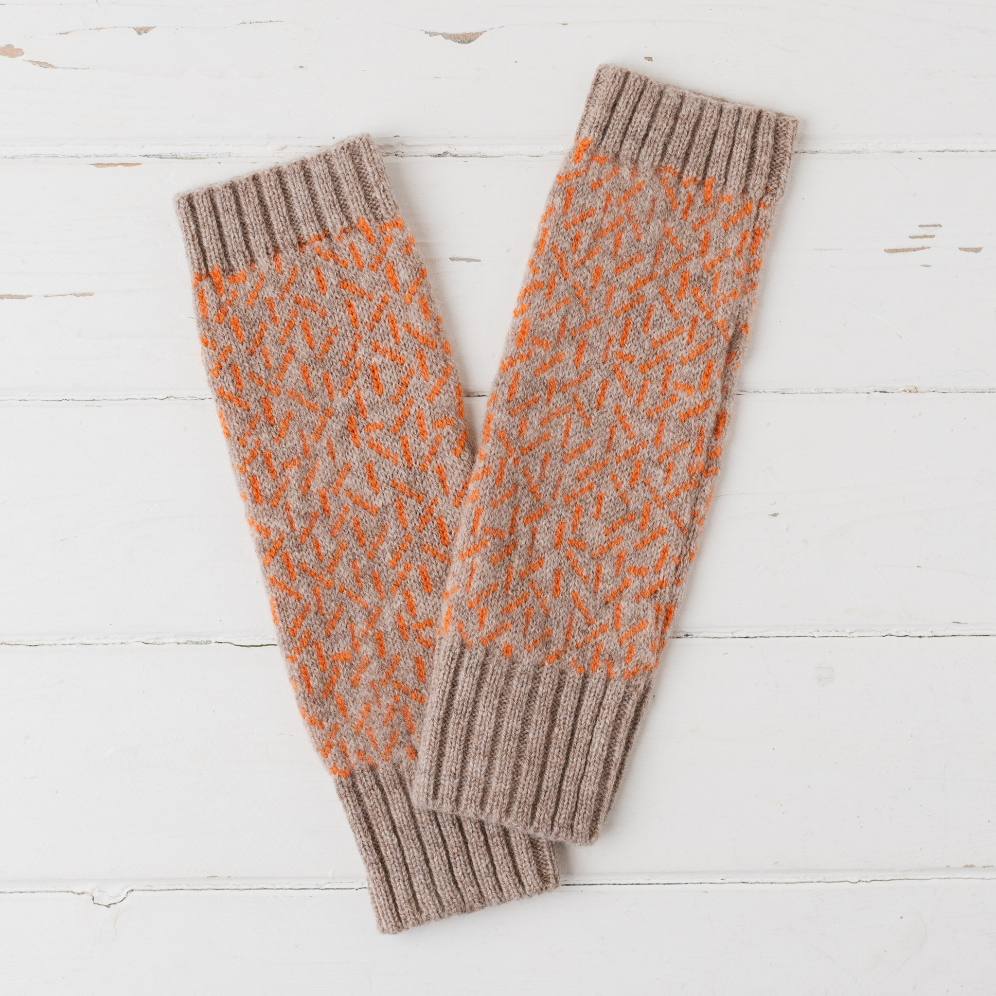 Scatter wrist warmers - cobble and orange soda