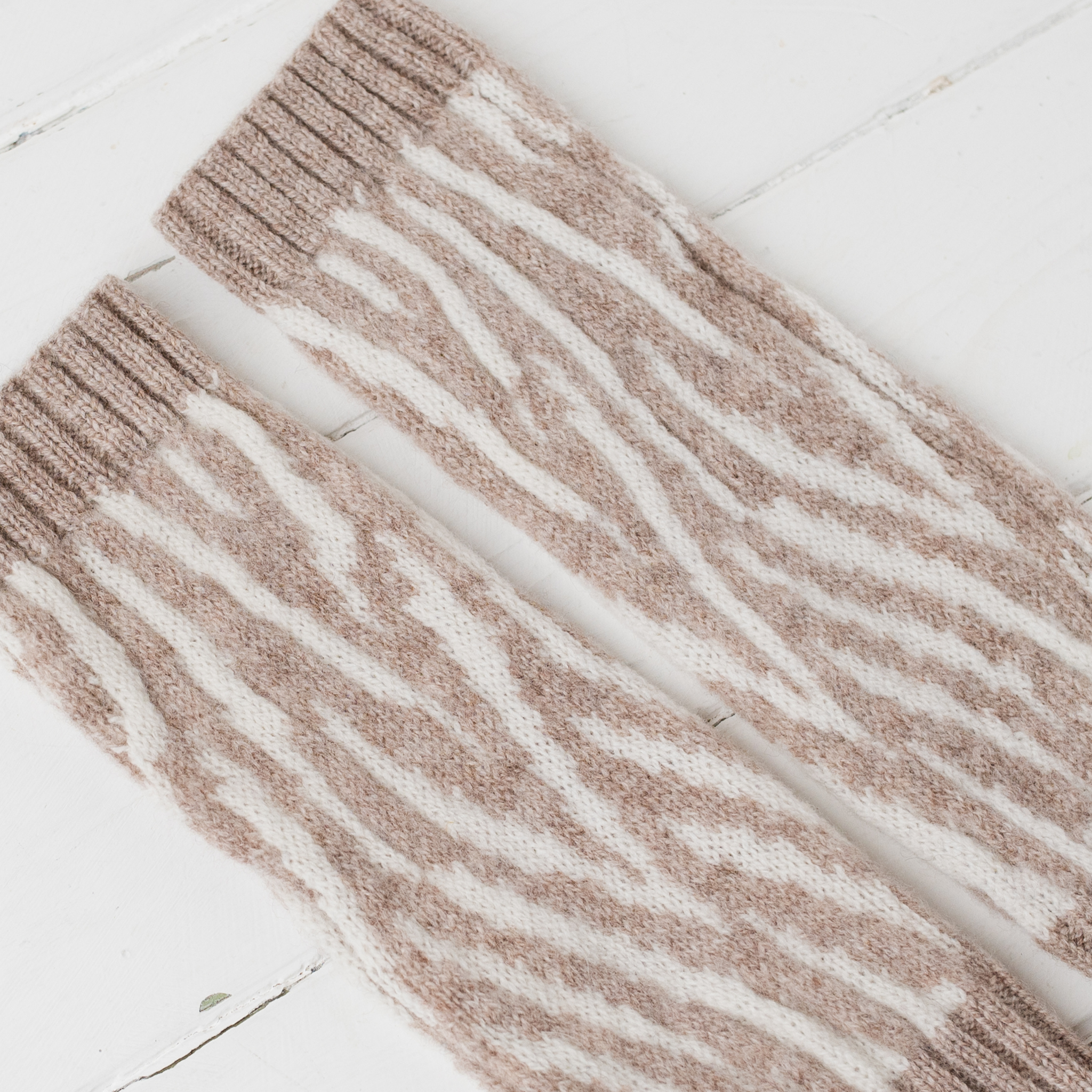 Zebra wrist warmers - cobble and white