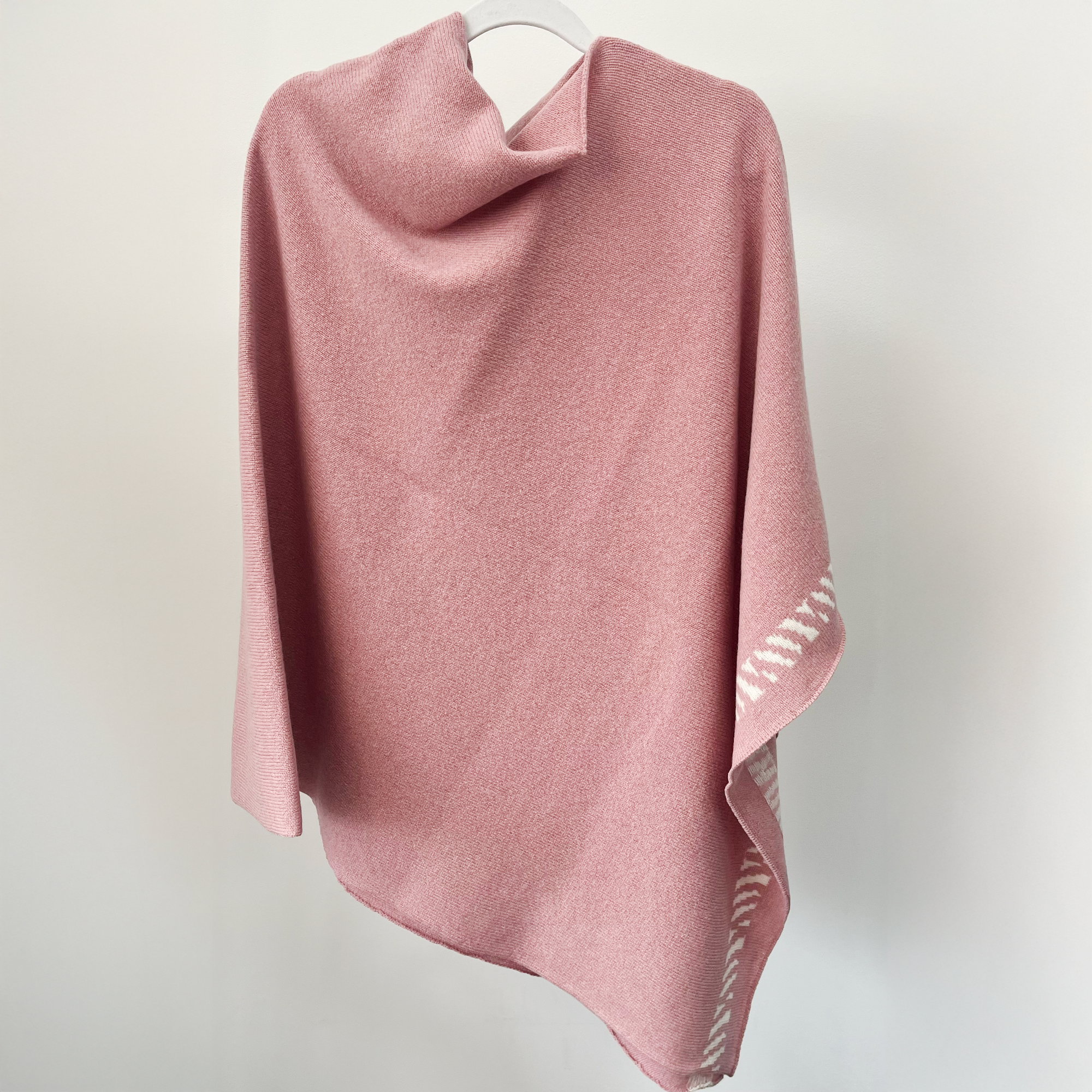 Lambswool knitted poncho - calamine pink and white