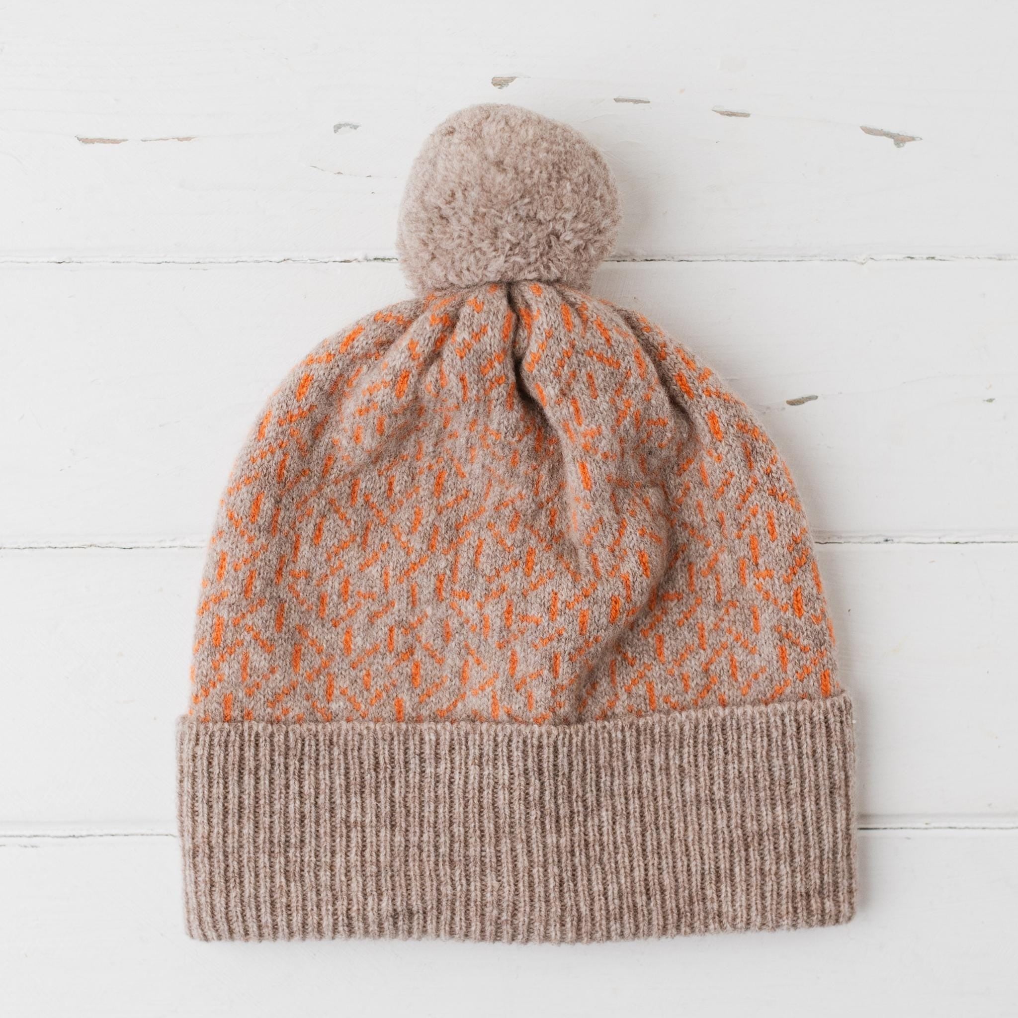 Scatter pom pom hat - cobble and orange soda