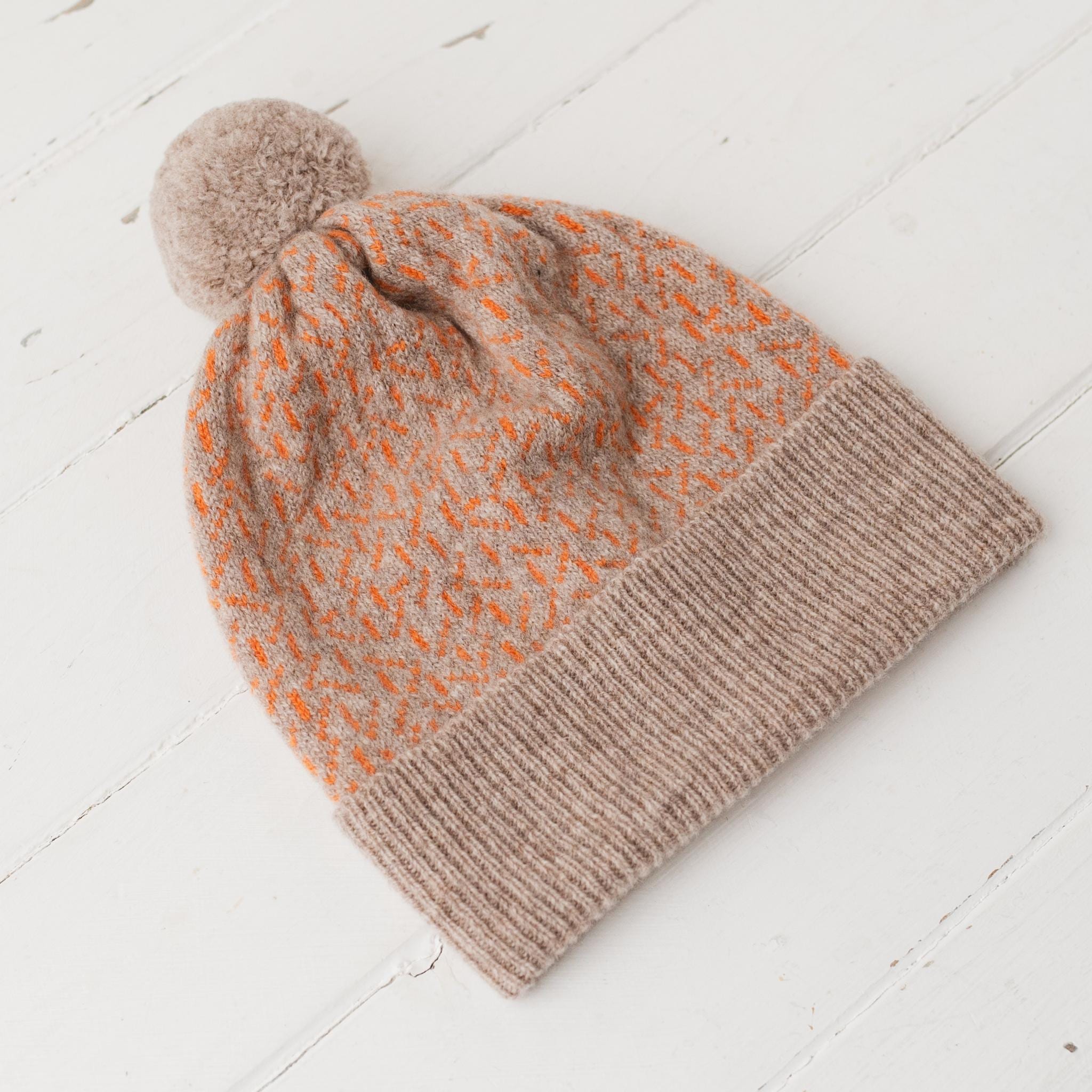 Scatter pom pom hat - cobble and orange soda