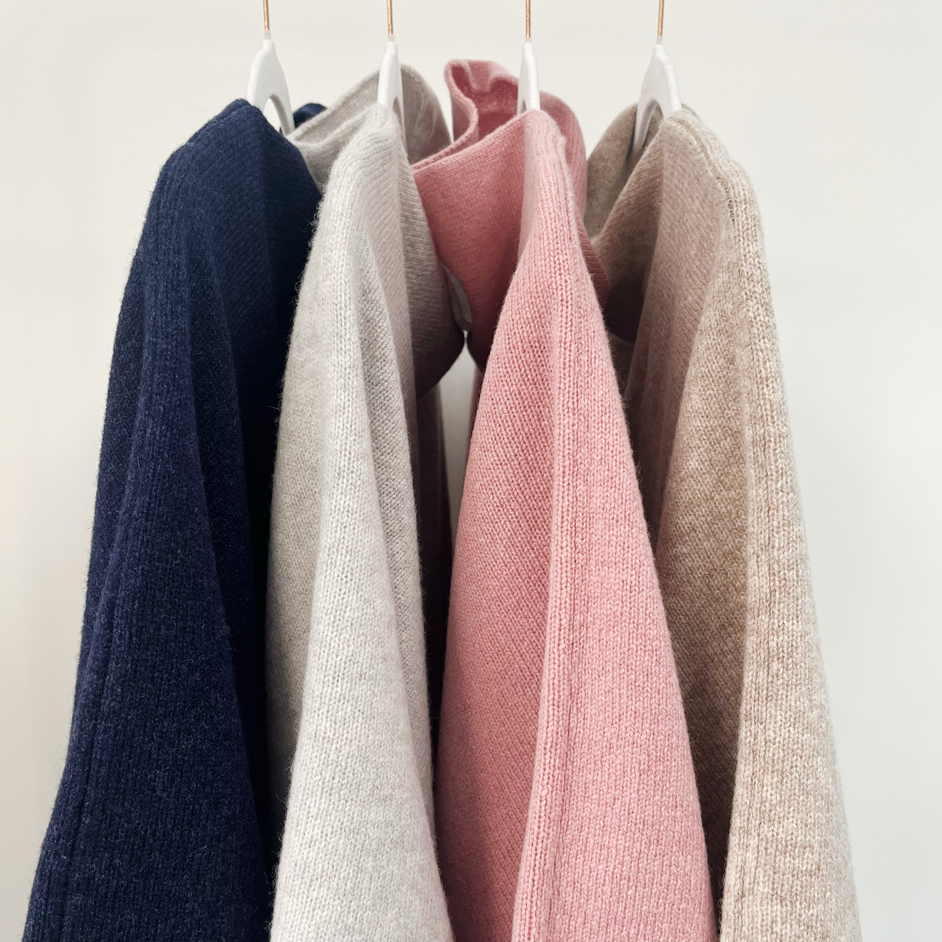 Lambswool knitted poncho - calamine pink and white